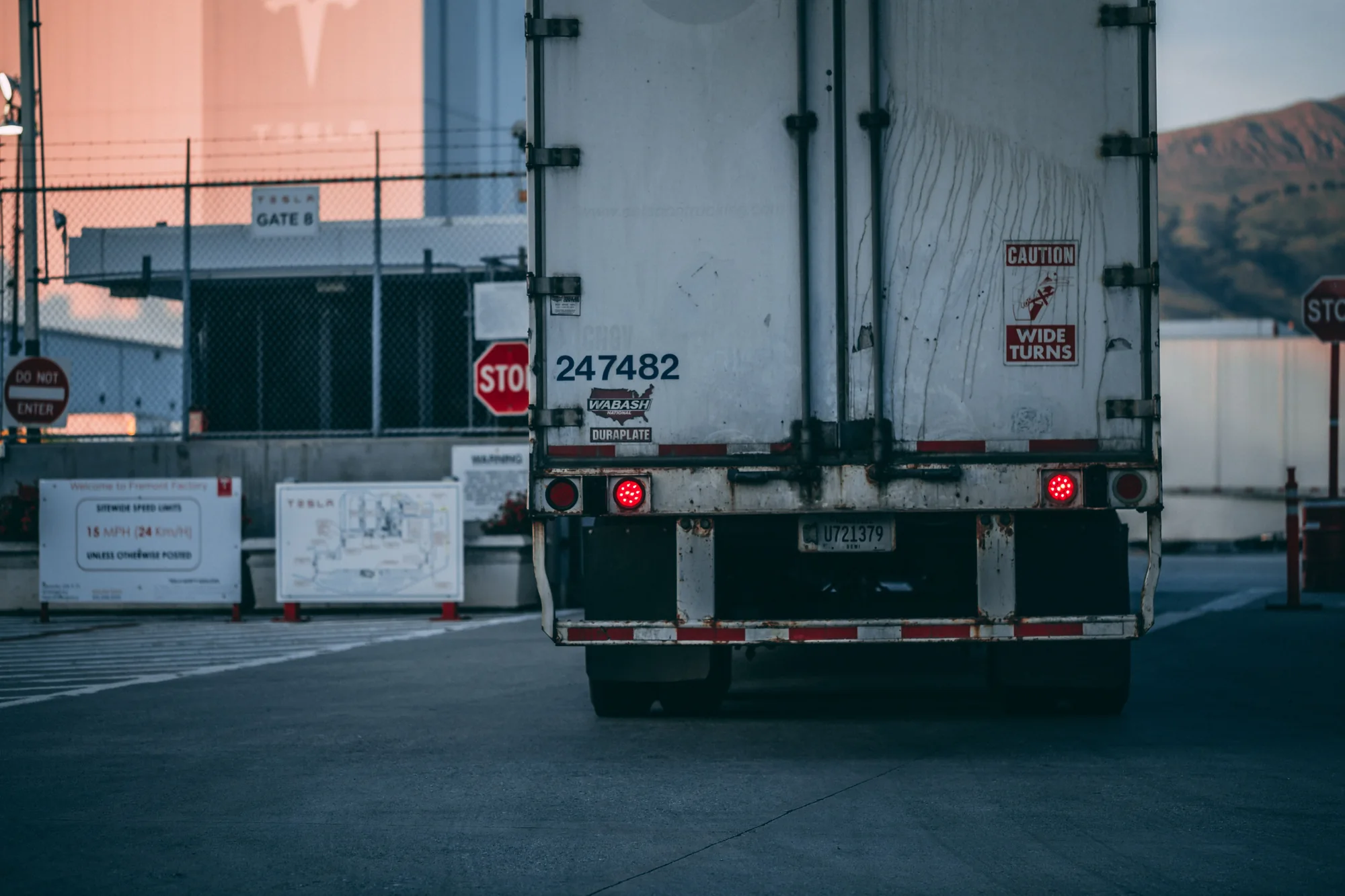 Freight trailer moving through an industrial facility